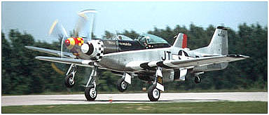 two P-51 Mustangs on take off
